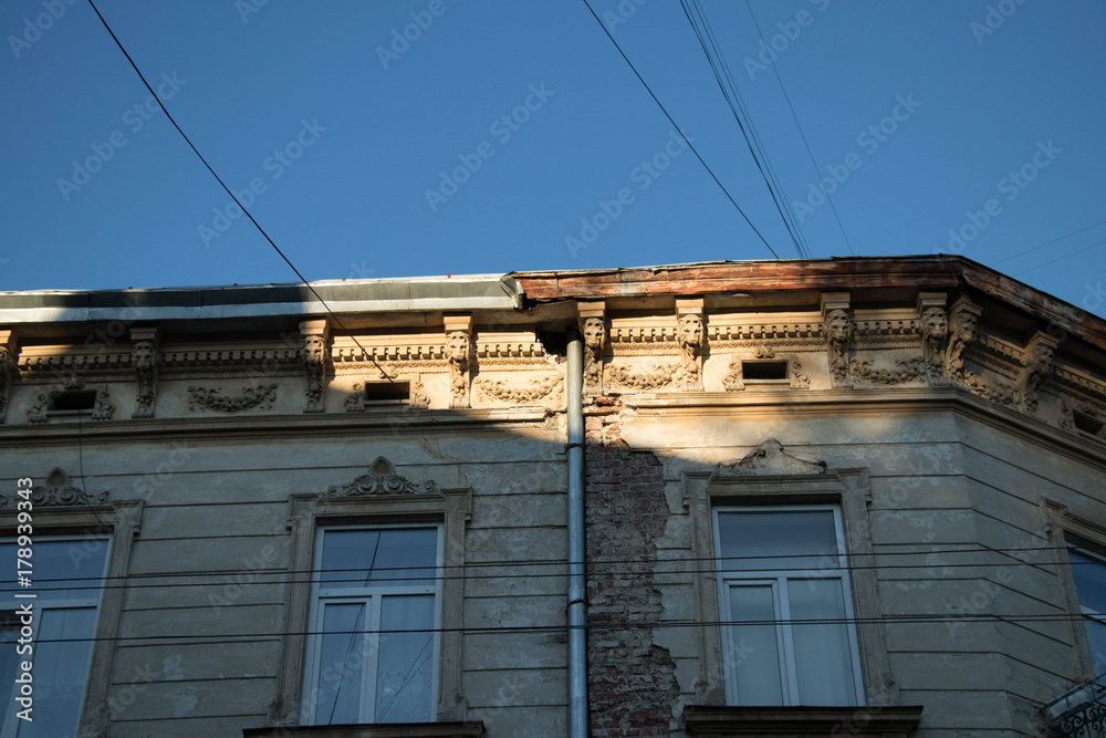 Buildings of an old European historic city hidden behind an afternoon shadow on a quiet summer day Buildings of an old European historic city hidden behind an afternoon shadow on a quiet summer day