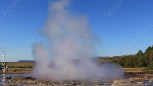 View of erupting Geyser Strokkur in a sunny day, Iceland 
