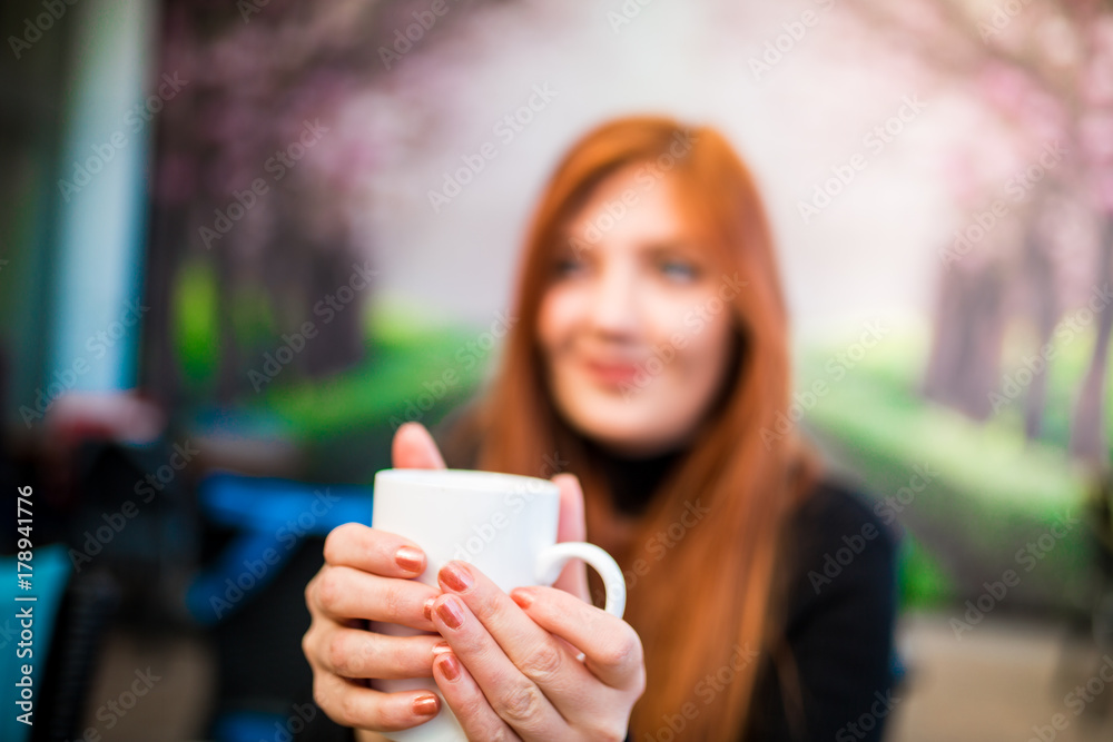 Beautiful girl drinking coffee at the coffee shop Beautiful girl drinking coffee at the coffee shop
