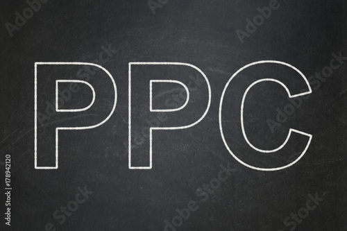 Marketing concept: text PPC on Black chalkboard background