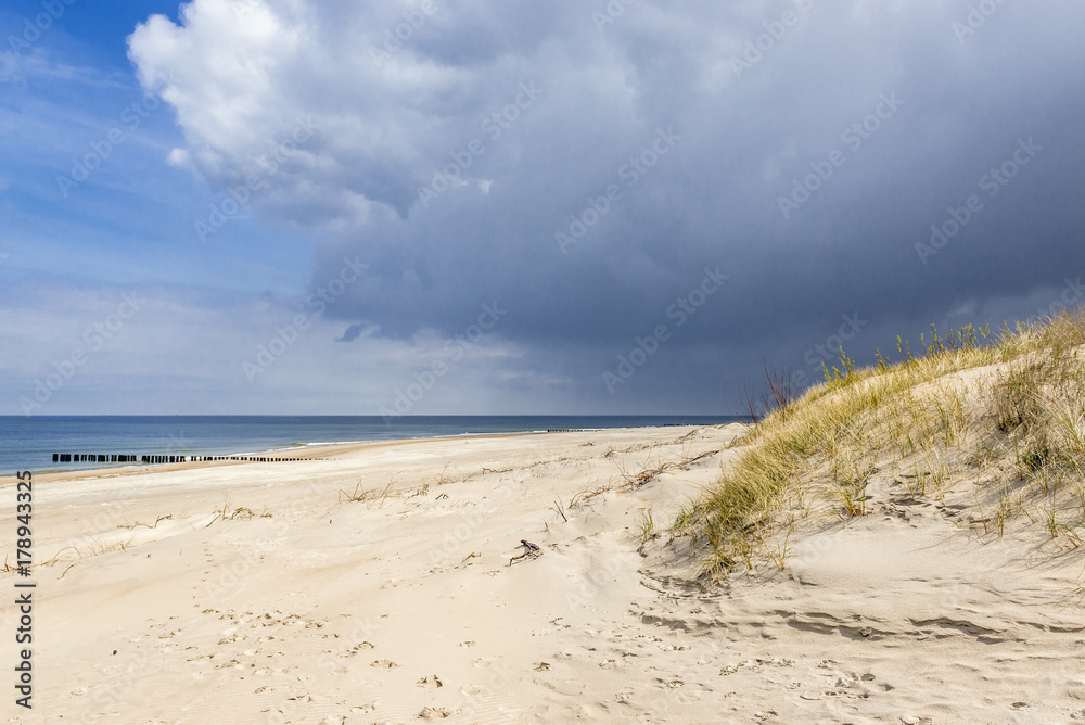 Sand dune on a Baltic Sea beach in Dziwnow town, Poland