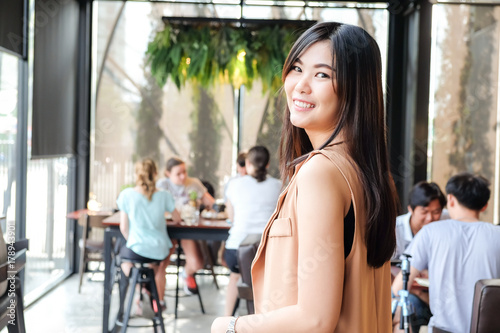 Business asian women smiling in modern cafe shop