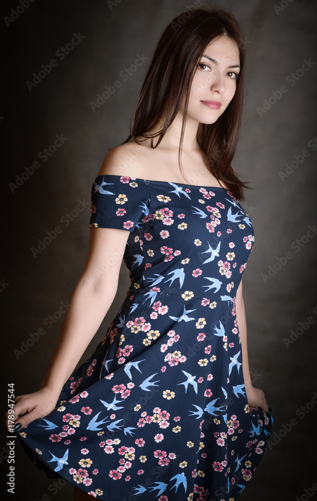 Happy beautiful woman in sundress on grey background. Happy beautiful woman in sundress on grey background.