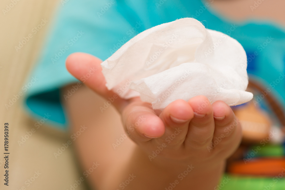 Fototapeta premium Napkin in a child's hand