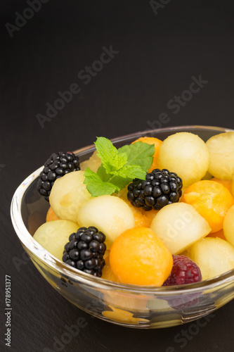 piel de sapo melon and cantaloupe with raspberries and blackberries