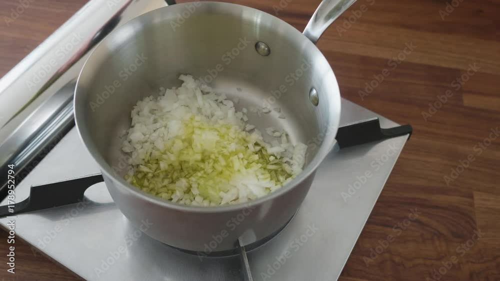 frying onion in a sauce pan frying onion in a sauce pan