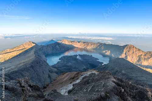 Scenery of Mount Rinjani, active volcano and crater lake from the summit at sunrise, Lombok - Indonesia.