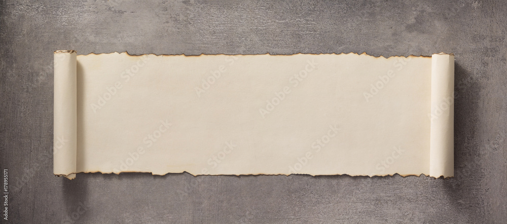 parchment scroll at concrete surface