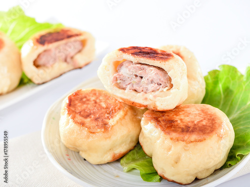 Photography pan-fried bun in white plate isolated on white background
