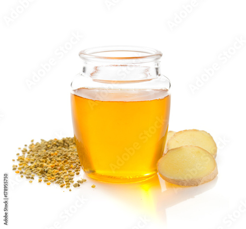 jar of honey on white background