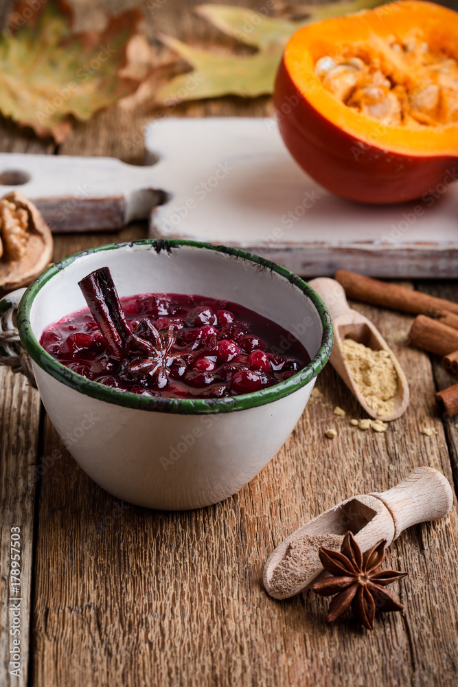 Homemade cranberry sauce in rustic mug, preparation Thanksgiving dinner Homemade cranberry sauce in rustic mug, preparation Thanksgiving dinner