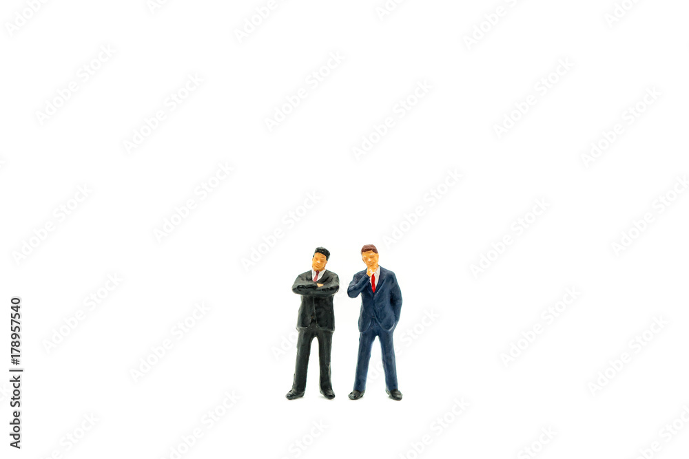 Miniature people, couple businessman standing isolated on white background using as business concept Miniature people, couple businessman standing isolated on white background using as business concept