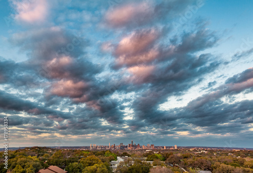 Sunset clouds descend upon the skyline over Austin, Texas