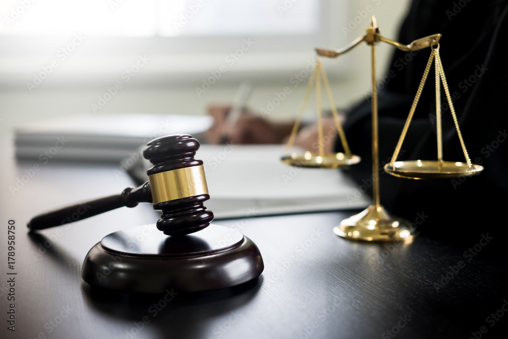 gavel and soundblock of justice law and lawyer working on wooden desk background. gavel and soundblock of justice law and lawyer working on wooden desk background.