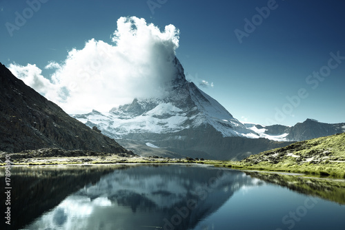 Reflection of Matterhorn in lake Riffelsee, Zermatt, Switzerland © Iakov Kalinin