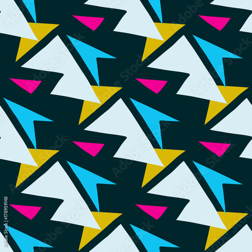 colored polygons on a dark background seamless geometric pattern