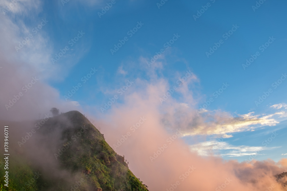 The beauty of the sky, forests, mountains and fog in the bright morning light. at Phu Miang, Udtaradit  Province,Thailand. subject is blurred.