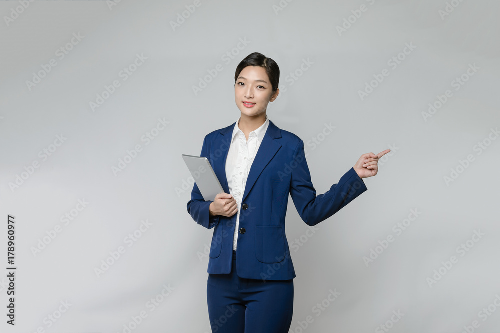 Young Woman use of tablet and finger point up Young Woman use of tablet and finger point up