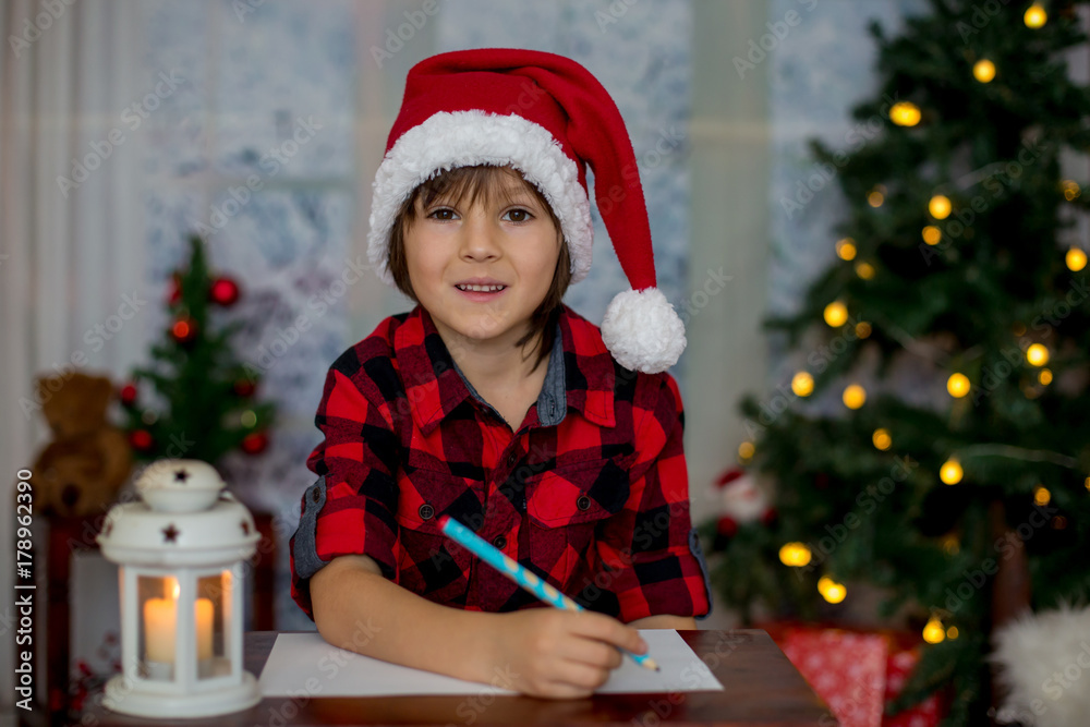 Adorable little boy, writing letter to Santa Adorable little boy, writing letter to Santa