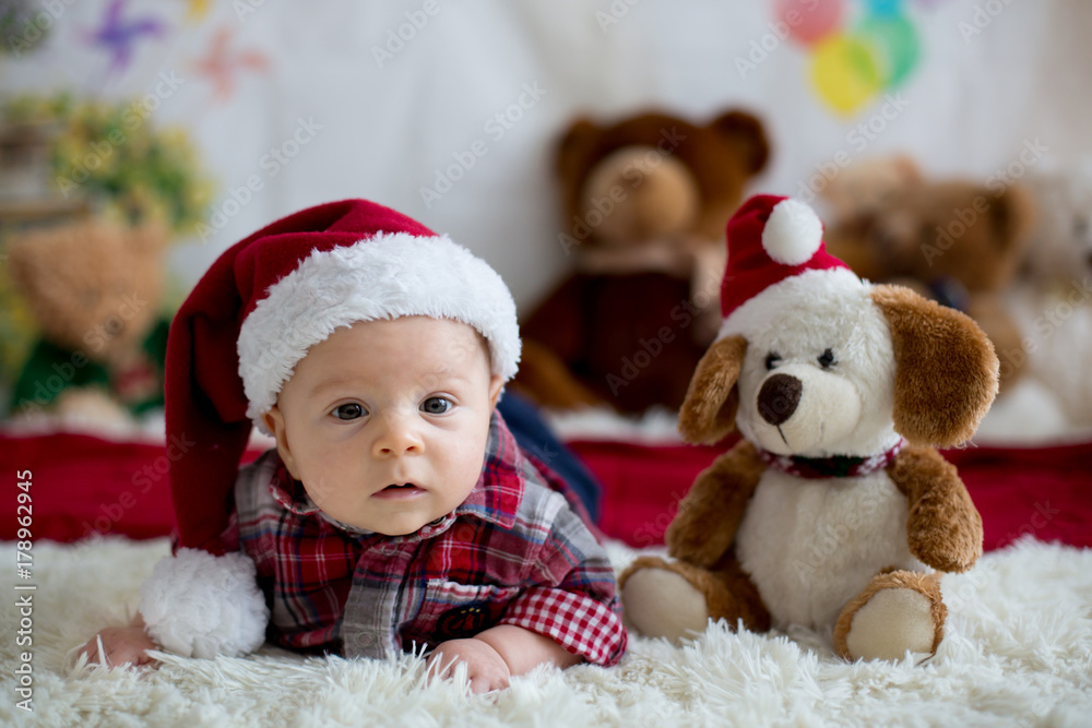 Christmas portrait of cute little newborn baby boy, dressed in christmas clothes Christmas portrait of cute little newborn baby boy, dressed in christmas clothes