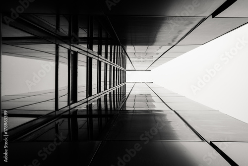 Urban Geometry, looking up. Modern architecture, glass and steel building. Abstract architectural design. Inspirational, artistic image. Industrial design. Minimal architecture view. Building exterior