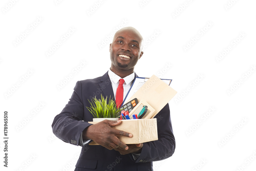 Portrait of African office worker holding box with personal belongings Portrait of African office worker holding box with personal belongings