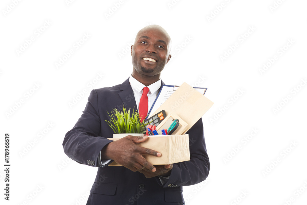 Portrait of African office worker holding box with personal belongings Portrait of African office worker holding box with personal belongings