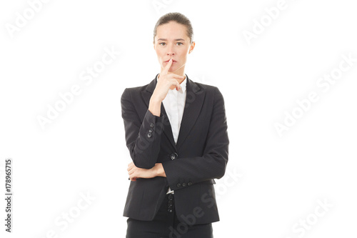 Portrait of young emotional businesswoman in formal suit on white background
