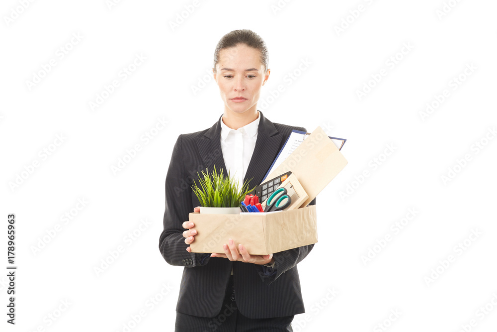 Portrait of female employee holding box with belongings Portrait of female employee holding box with belongings
