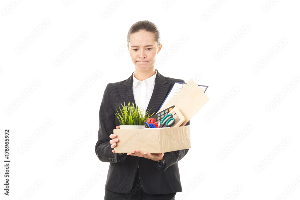 Portrait of female employee holding box with belongings Portrait of female employee holding box with belongings