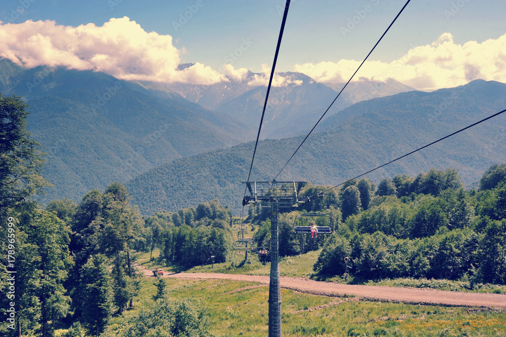 ropeway with open cabins in the mountains of the Caucasus