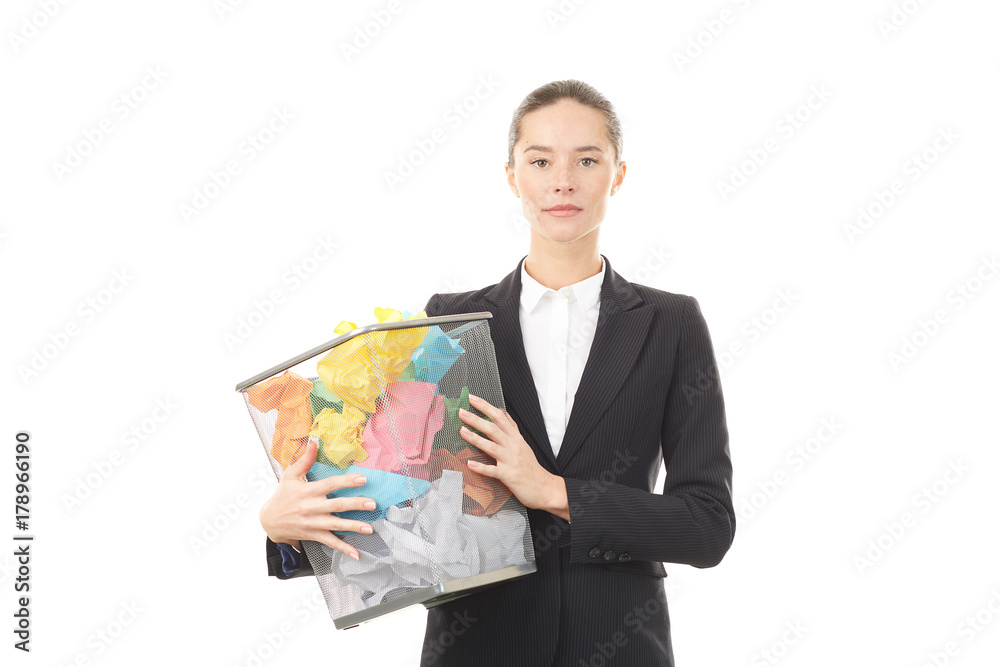 Portrait of female office worker holding basket with crumpled papers Portrait of female office worker holding basket with crumpled papers