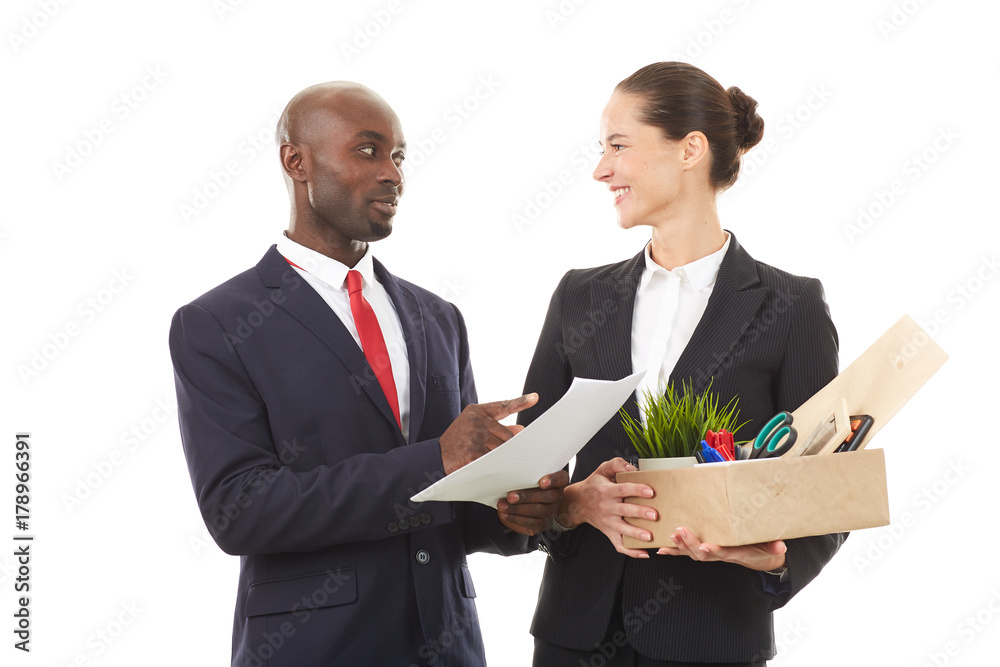 Portrait of male employer and female employee holding box with personal belongings Portrait of male employer and female employee holding box with personal belongings