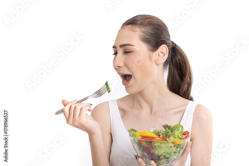 Portrait of Beautiful woman with vegetable salad. photo