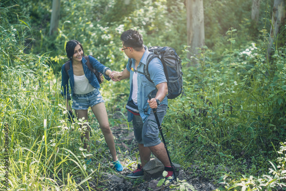 adventure, travel, tourism, hike concept , Smiling couple walking with backpacks outdoors. adventure, travel, tourism, hike concept , Smiling couple walking with backpacks outdoors.