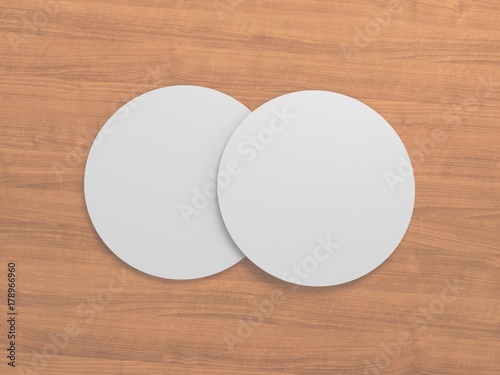 3D Rendering white coasters isolated on wooden background