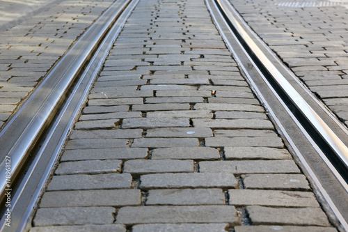 Tram rails on cobbled road surface