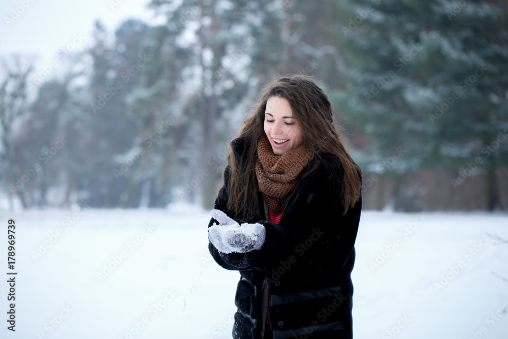 Happy woman with snow