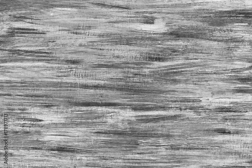 Black and White background of painted texture on wood plank.