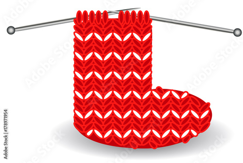 red and white Christmas sock on needles for the holidays...