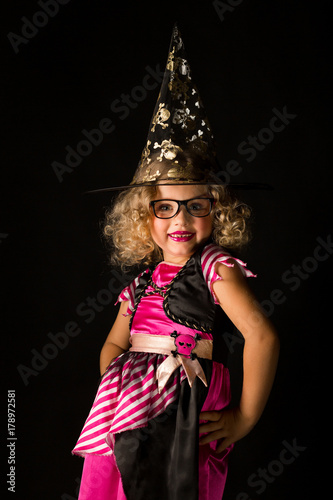 Attractive girl in witch halloween costume