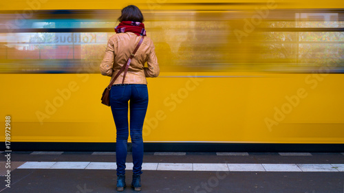 Canvas Print Woman waiting for train.