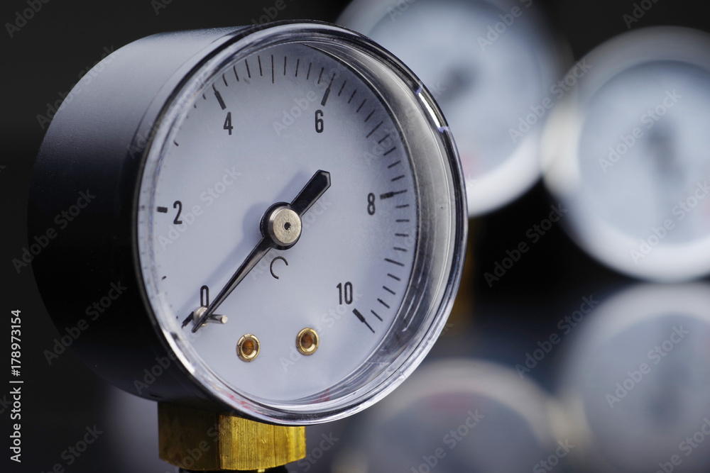 Manometer in close-up. A pressure gauge on the background of other instruments. 