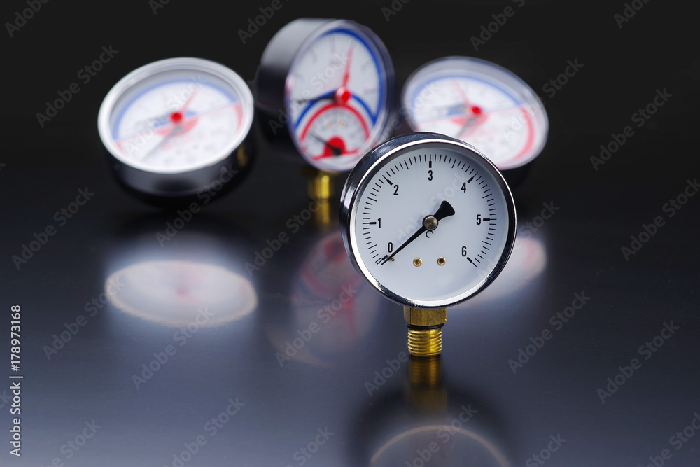 Manometer in focus. A pressure gauge on the background of other instruments. Manometer in focus. A pressure gauge on the background of other instruments.