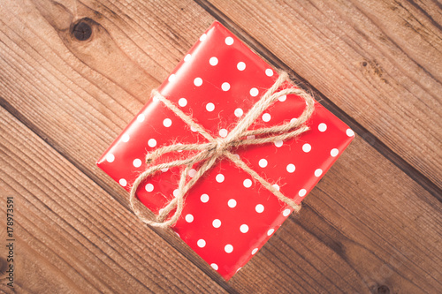 Gift on wooden table. Christmas background. top view