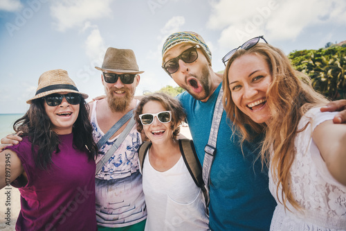 A group of young people do selfie on the beach. Friendship  freedom  travel.