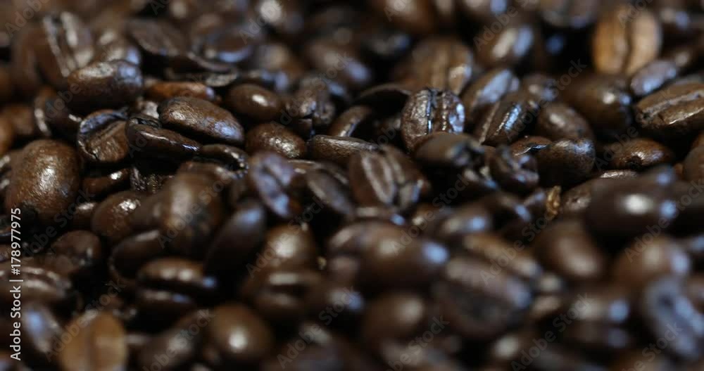 Roasted brown coffee beans, can be used as a background. 4k video. Roasted brown coffee beans, can be used as a background. 4k video.