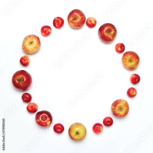 Food concept - many apples fruits in the shape of circle isolated on a white background, flat lay, empty copy space