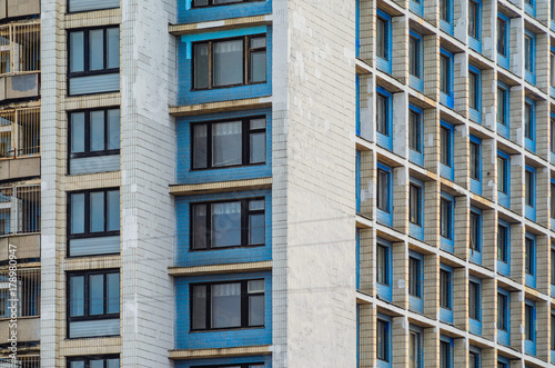 Facade of an old high-rise building. Urbanization concept