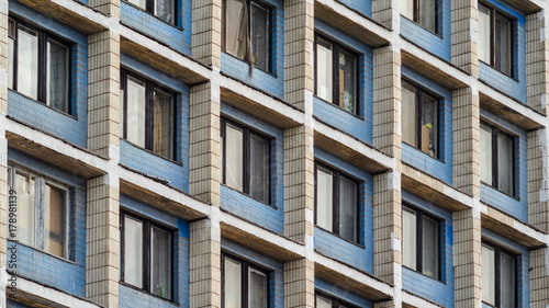 Facade of an old high-rise building. Urbanization concept